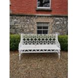 Decorative cast iron garden seat in the Gothic style. { 84cm H X 135cm W X 51cm D }.