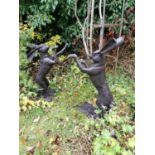 Pair of bronze models of boxing hares. { 89cmm H }.