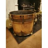 Oval brass coal bucket. { 35cm H X 38cm W }.