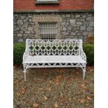 Decorative cast iron garden seat in the Gothic style. { 84cm H X 135cm W X 51cm D }.