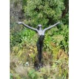 Bronze sculpture of lady with out swept arms ‘ stepping into spring’ { 140cm H X 114cm W }.