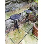 Pair of cast iron circular patio tables.