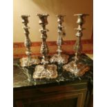 Set of four English silver plated table candle sticks. { 30cm H }.