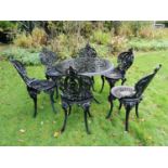 Set of six cast iron garden chairs and matching table. { 88cm Dia. }.