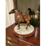 Bronze group mare and foal on a circular marble revolving base. by Cindy Wolf