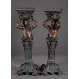 Colonne portavasi in bronzo a forma di putti. Inizi XX secolo. Mis. Alt. cm. 125 ca.