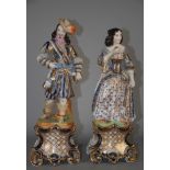 Due sculture in porcellana policroma raff. ''DAMINA E GENTILUOMO''. XIX secolo. Mis. Alt. cm. 41 ca.