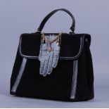 LULU GUINNESS. Handbag in velluto rigato nero decorato con guanto in pelle. Mis. Lung. cm. 27 Alt.
