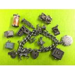 STIRLING SILVER BRACELET WITH NINE NOVELTY CHARMS AND HEART PADLOCK CLASP 2.