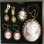 ROLLED GOLD BAS RELIEF CLASSICAL CAMEO BROOCH AND MATCHING CLIP ON EARRINGS AND A 9CT GOLD CAMEO