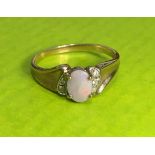 9CT FIERY OPAL AND CZ CROSSOVER RING 2.