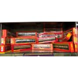 SHELF OF BOXED 00 GAUGE COACHES BY MAINLINE, PALITOY,