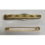 CASED 9CT BAR BROOCH AND A 9CT GOLD ON SILVER TIE SLIDE