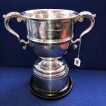 SILVER PRESENTATION TROPHY WITH LEAF CAPPED ENGRAVED SCROLL HANDLES,