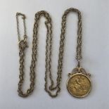 GEORGE V HALF SOVEREIGN 1911 IN MOUNT ON 9CT GOLD CHAIN 10.