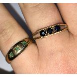 9CT GOLD THREE STONE SAPPHIRE RING SIZE-S AND A 9CT GOLD EMERALD GYPSY STYLE RING SIZE N 4.