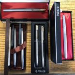 TWO BOXED PARKER FOUNTAIN PENS (POLISHED STEEL, ONE WITH GOLD TRIM),