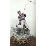 CAPO DI MONTE PORCELAIN FIGURE GROUP OF THE FISHERMAN BY SANDRO MAGGIONI ON A GILT METAL BASE WITH