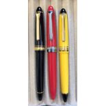 SAILOR 1911 FOUNTAIN PENS - ONE YELLOW AND ONE BLACK WITH GOLD TRIM,