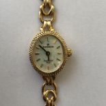 LADIES 9CT GOLD CASED AND STRAP SOVEREIGN WRIST WATCH 8.