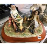 CAPO DI MONTE PORCELAIN 'KING FOR A DAY' FIGURE GROUP BY ROBERTO 'B' ON A WOODEN PLINTH 46CM W,