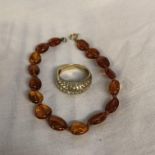 AMBER BEAD BRACELET WITH 9CT GOLD LINK AND A 9CT GOLD DRESS RING 5.