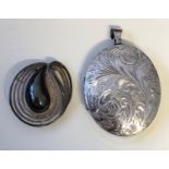 LARGE SILVER ENGRAVED OVAL LOCKET AND SILVER SWIRL BROOCH