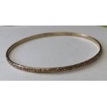 9CT GOLD ENGRAVED BANGLE 7.