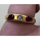 UNMARKED YELLOW METAL DIAMOND AND RUBY RING 4G APPROX