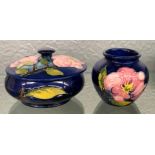MOORCROFT POTTERY BOWL AND COVER MAGNOLIA PATTERN ON A BLUE GROUND 13CM DIA APPROX AND A SQUAT