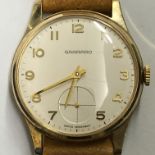 GENTLEMANS 9CT GOLD GARRARD WRIST WATCH ON LEATHER STRAP IN CASE