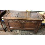 18TH CENTURY CARVED OAK THREE PANEL FRONT COFFER HAVING CARVED DECORATION AND CHEQUER INLAY A/F