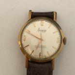 UNMARKED YELLOW METAL GENTLEMANS ACCURIST WRIST WATCH ON BROWN LEATHER STRAP (TESTED) 9CT GOLD