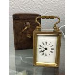 MINIATURE FRENCH BRASS CARRIAGE CLOCK IN LEATHER CASE 6.