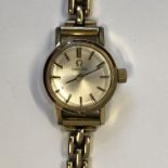 LADIES OMEGA WRIST WATCH ON A 9CT GOLD BRACELET 16.