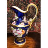 19TH CENTURY PORCELAIN ROYAL BLUE AND GILDED EWER PAINTED WITH BOTANICAL SPRAYS 37CM H APPROX