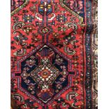 CAUCASIAN RUG ON A RED AND BLUE GROUND 105CM X 200CM APPROX