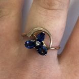 UNMARKED ROSE METAL CROSS OVER SAPPHIRE AND DIAMOND RING SIZE P, 2.