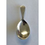 GEORGE III SILVER CADDY SPOON WITH BRIGHT CUT DECORATION LONDON MARKS RUBBED