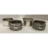 PAIR OF PLAIN SILVER NAPKIN RINGS, SHEFFIELD AND A PAIR OF SILVER EMBOSSED NAPKIN RINGS, BIRMINGHAM,