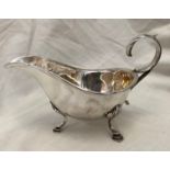 SILVER SAUCE BOAT WITH OPEN SCROLL HANDLE RAISED ON CABRIOLE LEGS WITH PAD FEET, 3.3OZ APPROX.