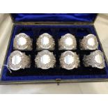 CASED PART SET OF EIGHT REPOUSSE NAPKIN RINGS WITH PLAIN CARTOUCHE, LONDON, 8OZ APPROX.