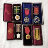 FIVE CASED ROYAL ORDER OF BUFFALO SILVER AND GILT ENAMEL MEDALLIONS