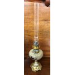 BRASS OIL LAMP WITH FLORAL RESERVOIR AND TALL FUNNEL