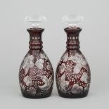 Pair of Bohemian Red Overlaid, Cut and Engraved Glass Decanters, 20th century, height 10 in — 25.5 c