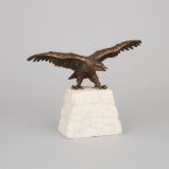 Patinated Bronze Model of an Eagle on a Carved Stone Plinth, early 20th century, wingspan width 10.5
