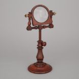 Early VIctorian Turned Mahogany Library Magnifying Glass on Stand, early 19th century, median height