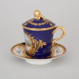 'Sèvres' 'Jeweled' Blue Ground Covered Cup and Saucer, early 20th century, saucer diameter 5.9 in —