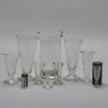 Group of Ten Pharmaceutical Glass Graduated Beakers and Vials, 19th/early 20th century, height 8.75