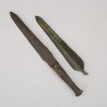 Two Luristan Bronze Daggers, Western Iran, 1200-1000 B.C., longest length 13 in — 33 cm (2 Pieces)